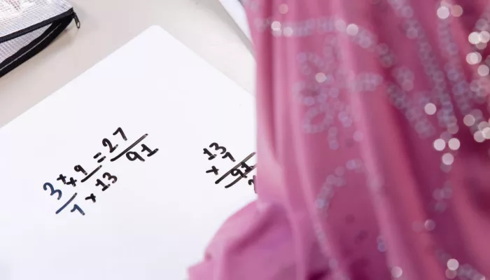 A pupils works on some Maths