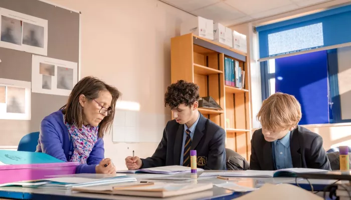 A tutor supports two Year 11 pupils with their Maths