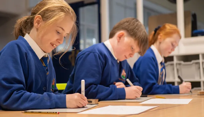 Pupils in blue uniforms at a primary school