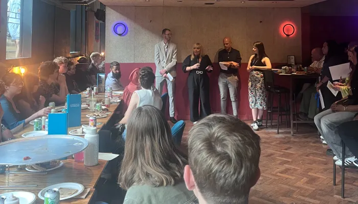 Tutors listen to a Tutor Awards speech in Greater Manchester