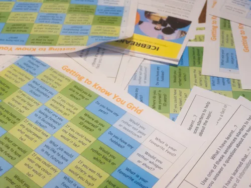 Lesson plans are laid across a table at a Tutor Trust workshop event