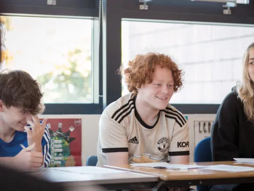 Secondary school pupils enjoying a tuition session in an alternative education provision.