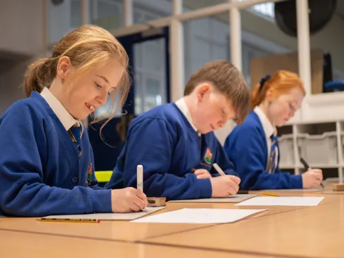 Pupils in blue uniforms at a primary school