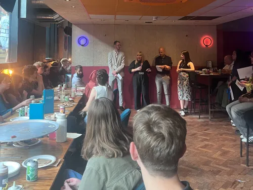 Tutors listen to a Tutor Awards speech in Greater Manchester