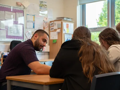 A male tutor in a classroom
