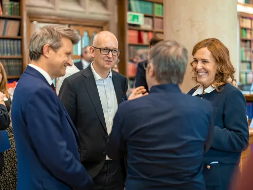 Trustees and Co-founder talking at Summer Reception